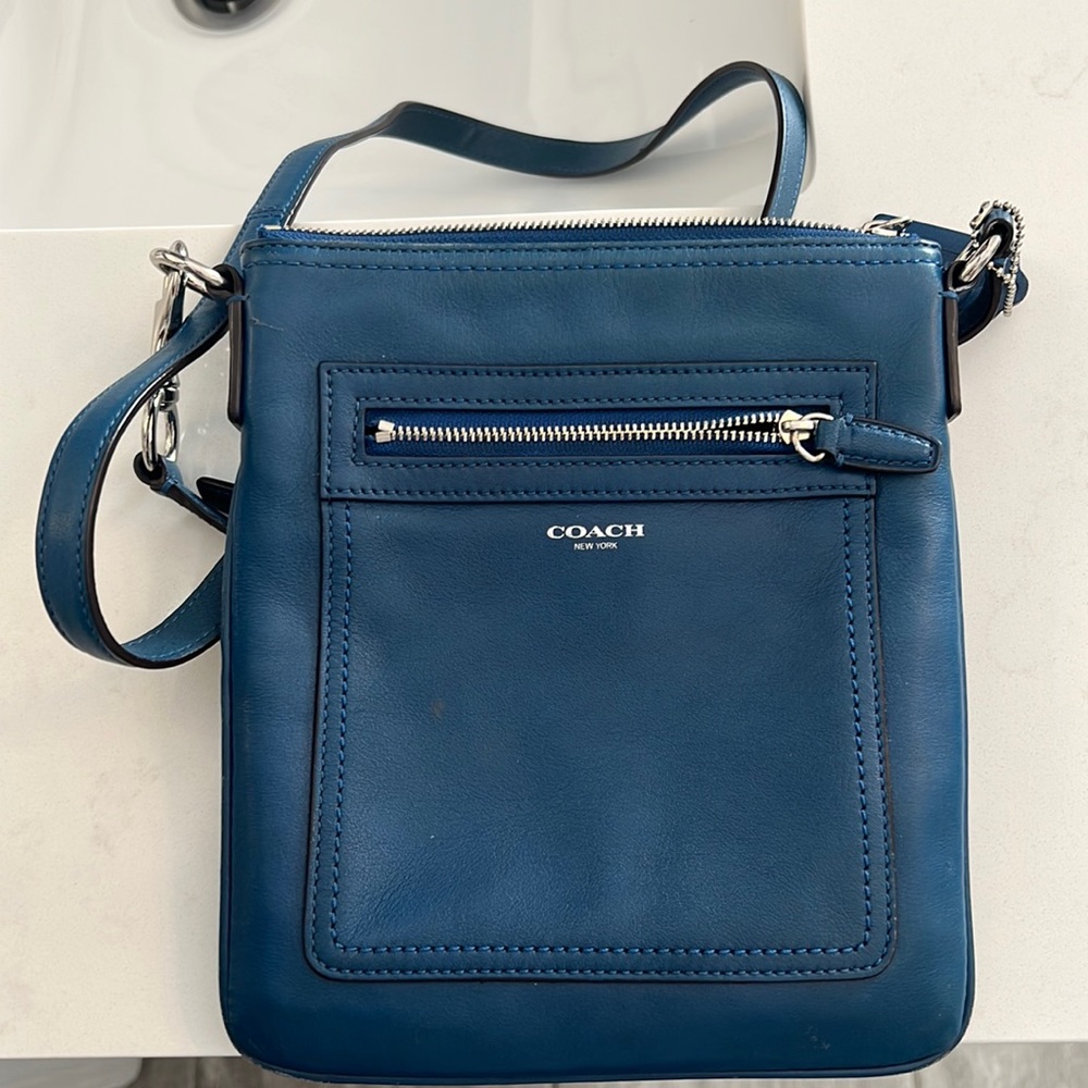 Blue leather coach crossbody bag.